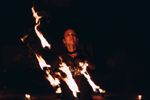 istock fireshow artist woman 2193996842