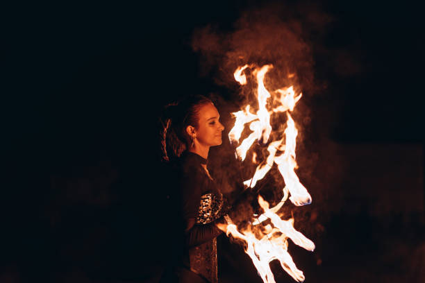 istock fireshow artist woman 2193996843