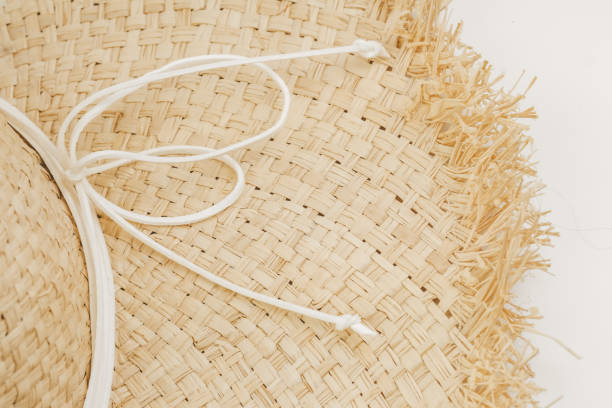 istock A close up of a woven straw hat with a white string tied around it and a fringed edge 2193997874