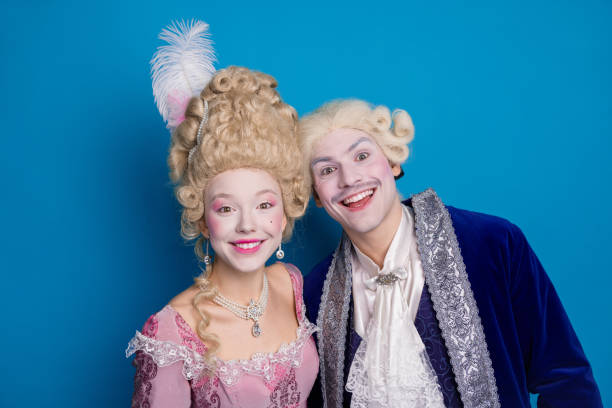 istock A joyful couple dressed in elegant baroque attire against a blue backdrop, capturing the essence of history with a playful modern twist. 2193998047
