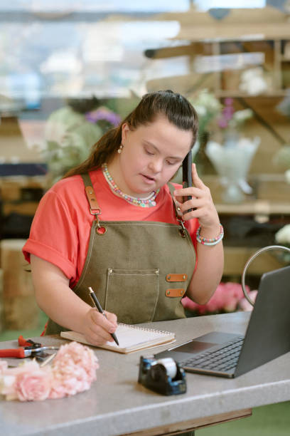 istock Woman Writing Down Details of Order 2193999033