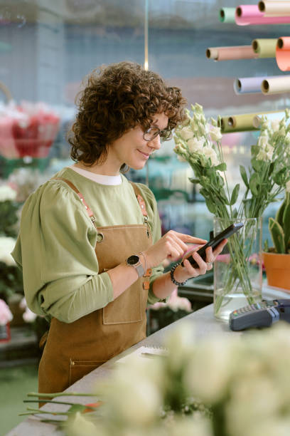 istock Florist with Smartphone in Shop 2193999189