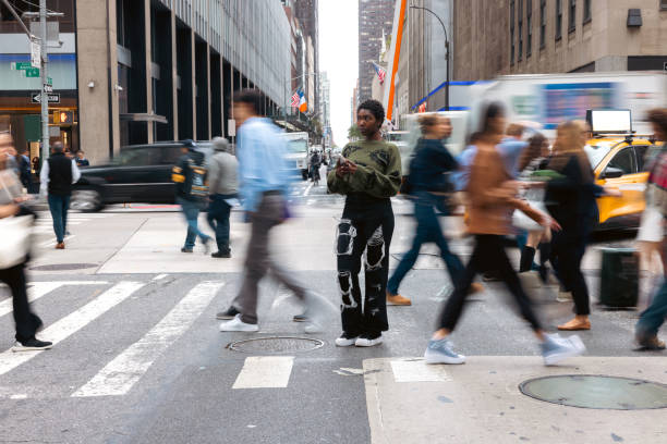 istock Young woman texting in the street 2193999367
