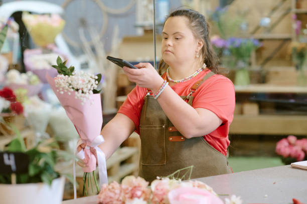istock Florist with Down Syndrome Taking Picture 2193999438