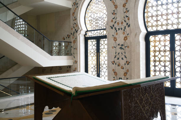 istock Elegant Interior Featuring Quran Stand with Ornamental Floral Decor and Patterned Windows 2194001212