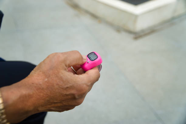 istock Close-Up of a Hand Holding a Digital Tally Counter 2194001400
