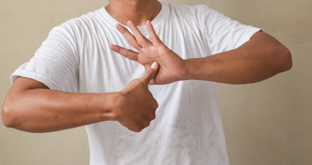 istock young man showing sign language with hand gestures speaking body language, hearing impaired interpreter 2194001577