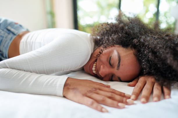 istock Serene Multiracial Woman Finding Perfect Comfort While Resting In Bed 2194002064