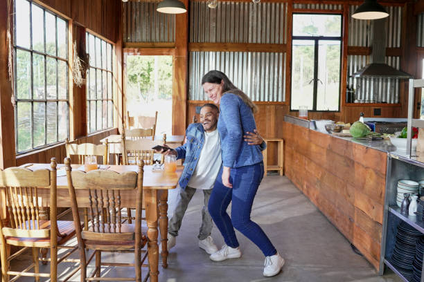 istock Two employees standing and embracing in restaurant 2194003993