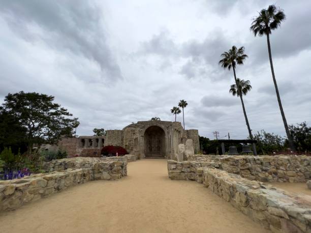 istock Historic Mission San Juan Capistrano under a cloudy sky, with stone structures in California. 2194004437