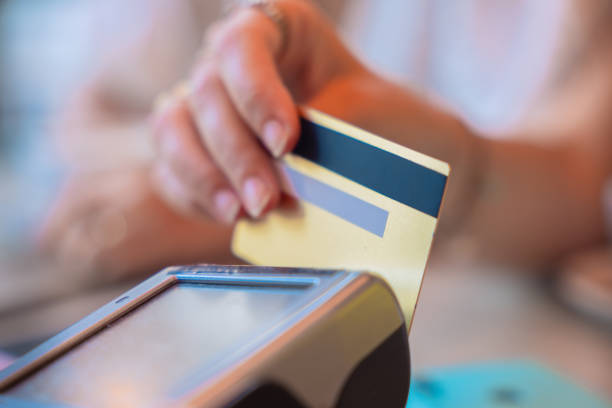 istock Hand Holding Credit Card Using Contactless Payment Terminal 2194006075