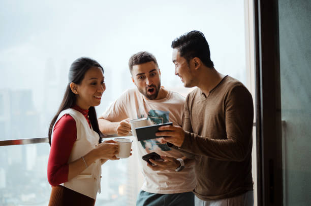 istock Asian people chatting at their apartments balcony 2194010729