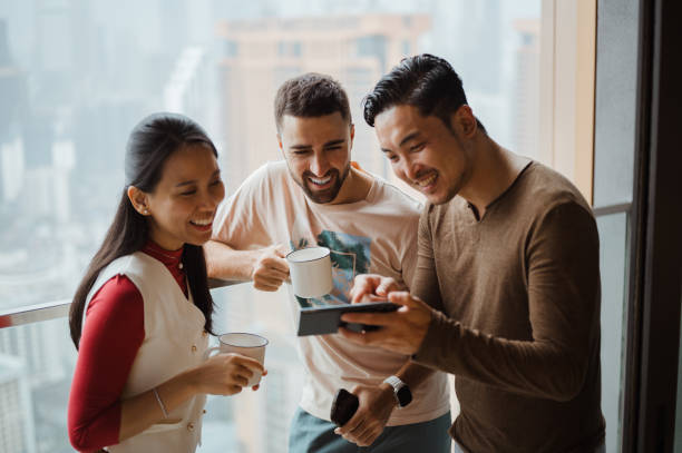 istock Asian people chatting at their apartments balcony 2194010742