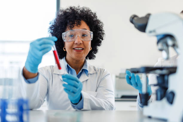 istock Scientist analyzing a red liquid in test tube in laboratory 2194013104
