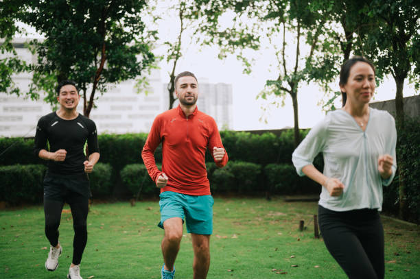 istock Asian people are exercising together at public park 2194013124