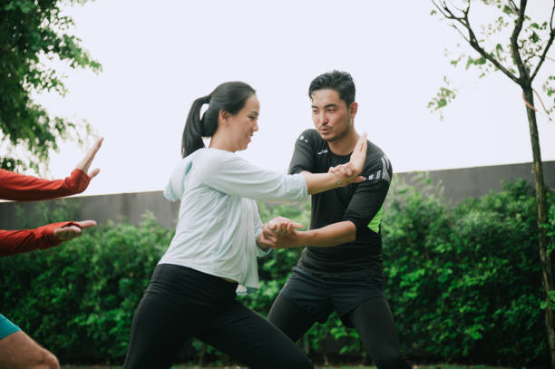 istock Asian woman is learning Tai Chi from her coach. 2194013385
