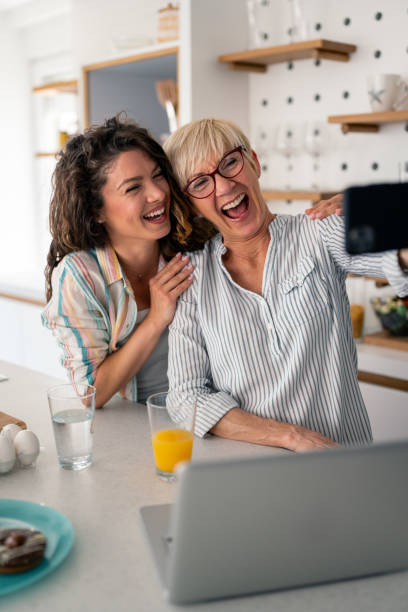 istock Joyful Mother and Daughter Selfie in Modern Kitchen 2194013436