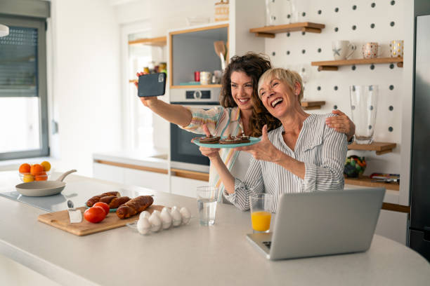 istock Smiling Caucasian Women Cooking Together in Modern Kitchen 2194013475