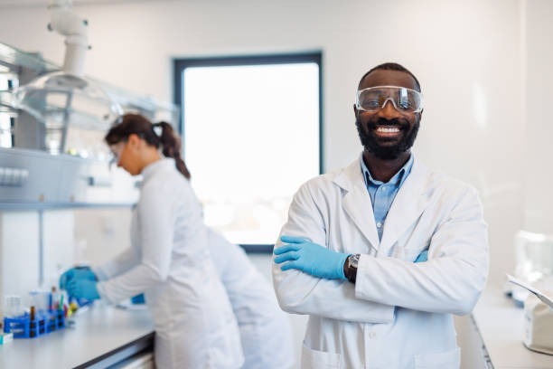 istock Portrait of a smiling scientist standing in a laboratory 2194013497