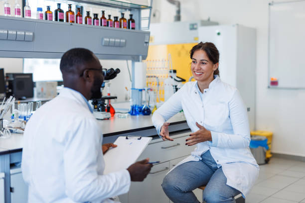 istock Scientists discussing research results in laboratory 2194013573