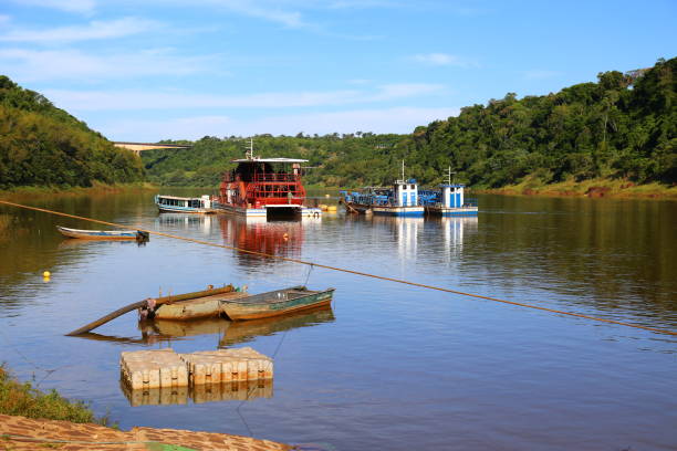 istock Boats and ships parked on the river calm water 2194014980