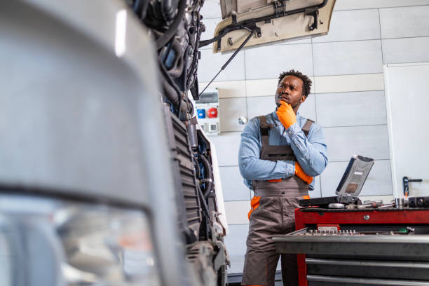 istock Professional mechanic thinking about solution to repair truck vehicle. 2194017163
