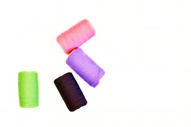 Colored cotton spools of various colors turquoise yellow red green