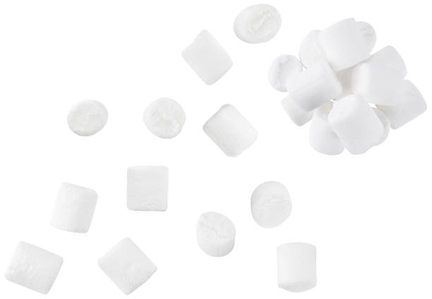 istock Pile white mini marshmallows isolated on a white background. Completely in focus. Top view. 2194018766