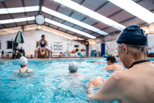 istock Rear view of a senior man on a swimming pool 2194020840