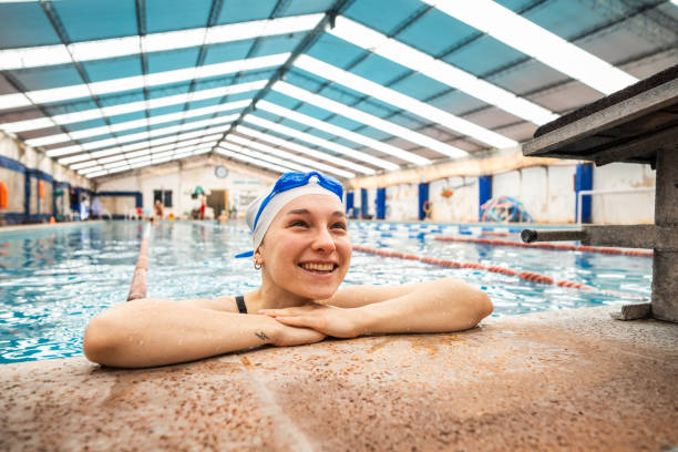 istock Young woman contemplating on a swimming pool 2194020966