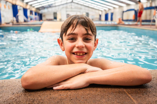 istock Portrait of a boy on a swimming pool 2194021187