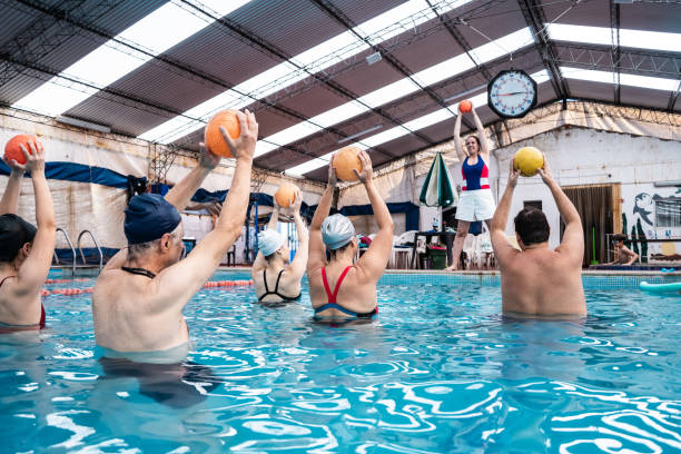 istock Teacher and students on hydrotherapy on a swimming pool 2194021312