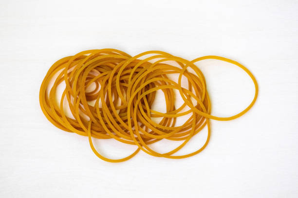 istock A group of rubber bands, isolated on a white background. These thick, elastic bands are ideal for stationery, office supplies, travel, home items, fixing, and organizing. 2194022151