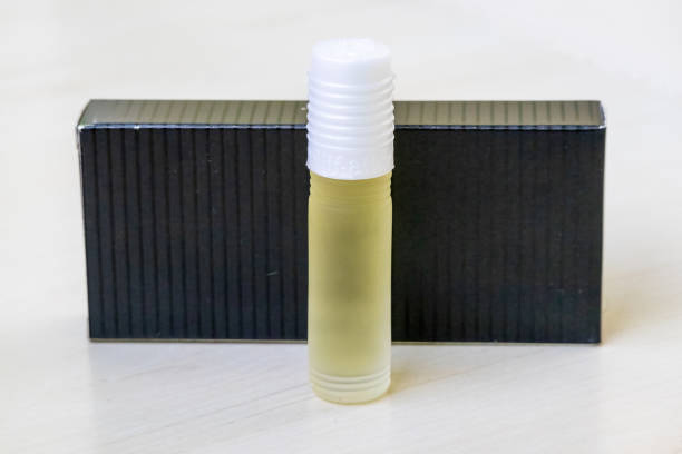 istock A bottle of natural attar perfume on a light wooden surface, with its box visible behind. 2194022181