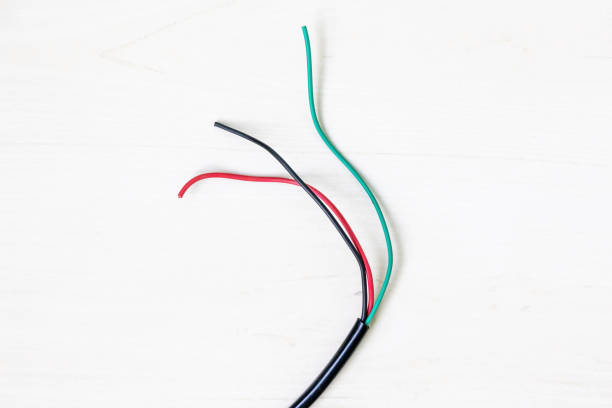 istock Used black, red, and green electrical cables are showcased on a white background, emphasizing the importance of recycling electronic waste. 2194022248