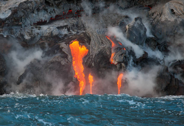 istock Red hot lava flowing into Pacific Ocean on Big Island, Hawaii 2194022277
