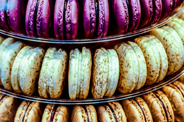 A stack of pastries with different colors and flavors. Concept of variety and abundance, as there are many different types of pastries in the stack