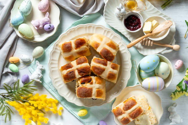 istock Traditional Easter hot cross buns on a white plate with butter, berry jam and honey. 2194023507