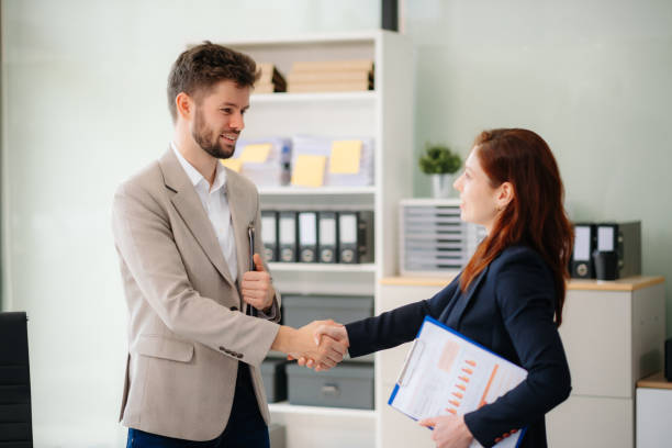istock business people shaking hands during a meeting in office 2194023576