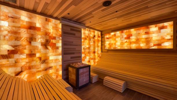 Modern Himalayan Salt Wall Sauna Interior with Warm Wooden Benches
