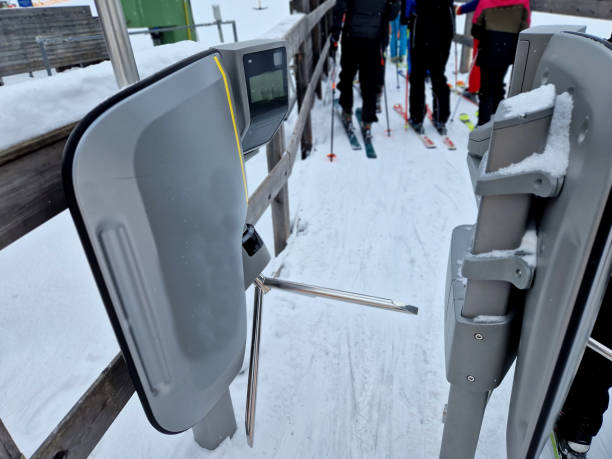 istock the ski lift is checked in using a turnstile that can read cards using a ski pass in a magnetic frame. the camera reads the faces of skiers who have paid to ski 2194025804