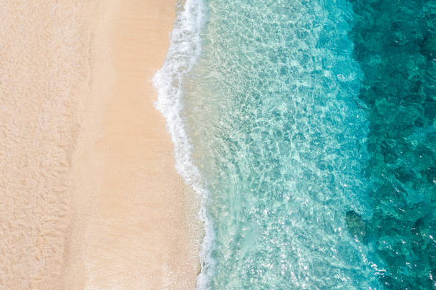 istock drone shot with a view of rolling waves on the beach 2194025913