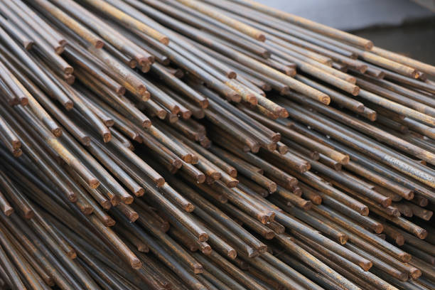 Close-up of rusted steel rods in a construction site.
