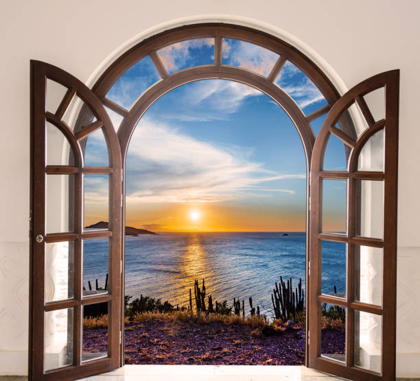 istock Window with a view of the ocean and a sunset 2194029607