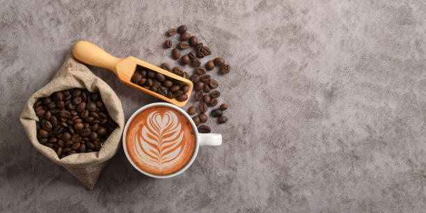 istock Coffee beans and cup of coffee latte 2194030130