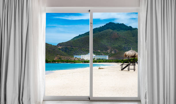 istock Beach with a white house in the distance 2194030401