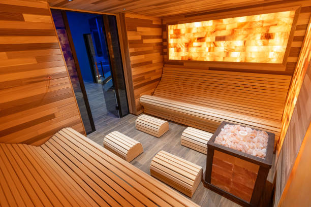 istock Luxury Modern Sauna Room With Relaxation Benches and Himalayan Salt Panel 2194032281