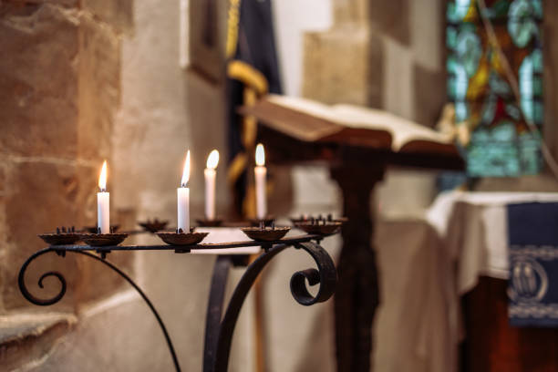 istock Lit prayer candles inside Anglican church 2194034290