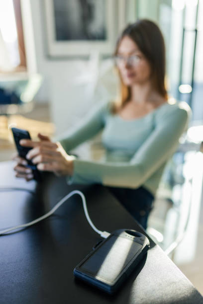 istock Charging smart phone with a power bank 2194034428