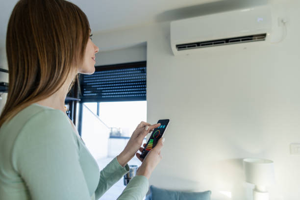 istock Controlling home air conditioning with smart phone 2194034477